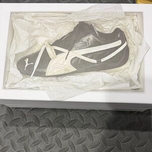 Women’s sold out Rosie Puma Collab Black and Cream Sneakers